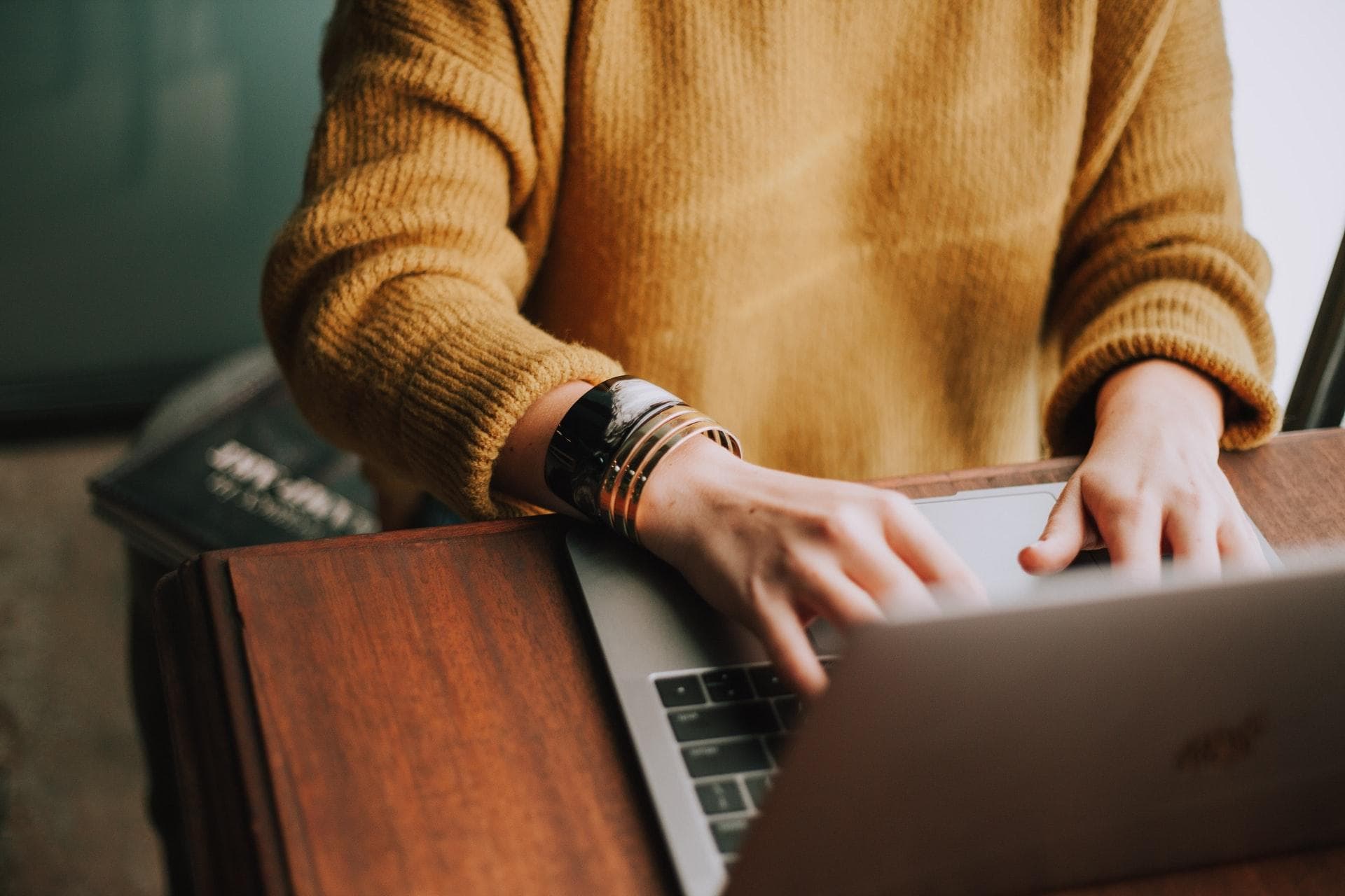Woman typing on a MacBook